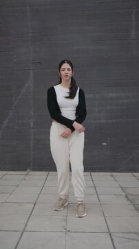 Young energetic woman dancing hip hop afrobeat