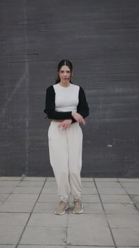 Young woman dancing afrobeat and hip hop outdoors