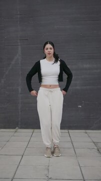 Energetic woman performing a modern afrobeat hip hop dance routine