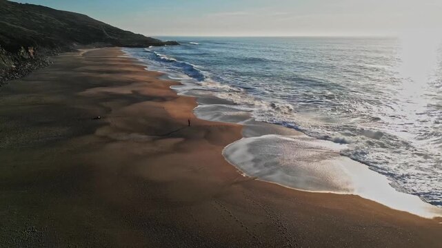 Peaceful beach view at Praia do Salgado, Nazare during sunset