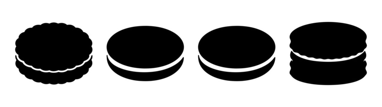 Set of four minimalist black and white cookies isolated on dark background