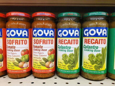 Delaware, U.S.A - March 31, 2026 - Goya Sofrito and Recaito jars displayed on a shelf, showing tomato and culantro cooking bases for various dishes.
