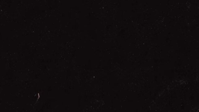 small noise with dust particles moving on black background 4k footage, dust particles with scratches for overlays footage, technical glitch animation footage