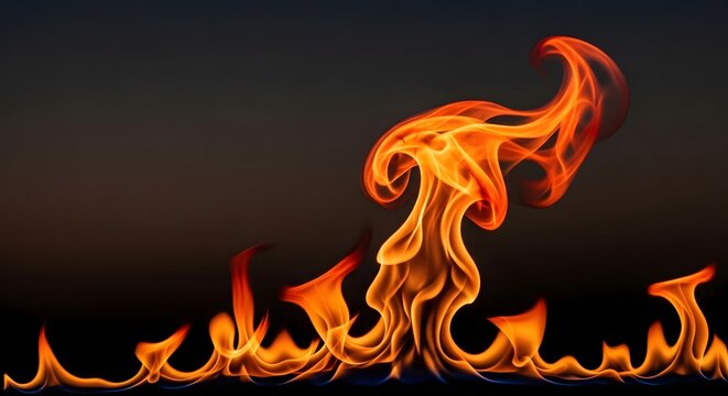 Vibrant orange and yellow flames dancing against a dark, smoky background, creating a dynamic and intense fiery display.