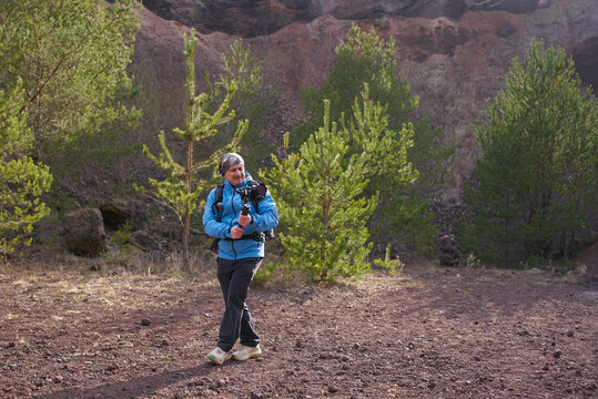 Videographer filming inside Racos volcano