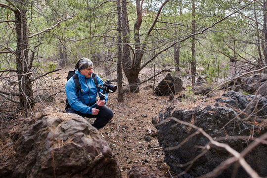 Videographer filming inside Racos volcano