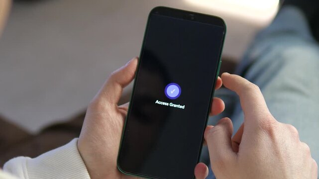 High-quality shot of a person verifying identity via a mobile app. Modern interface shows Authorize Access button and successful verification. Perfect for fintech, private messaging, and secure