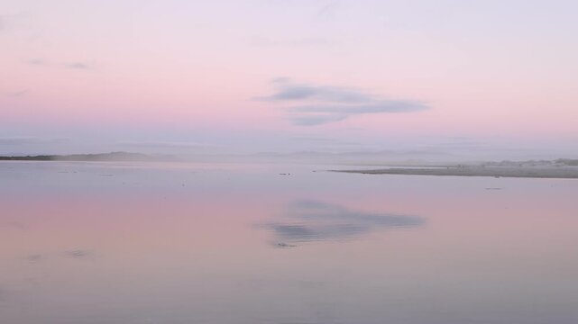 sunset over lagoon and reflection, Herman's, South Africa