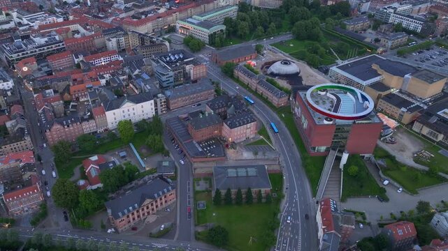 Aarhus, Jutland, Denmark - Aerial Drone View in Evening Twilight at ARoS Aarhus Art Museum. Shining Colorful Circle.
