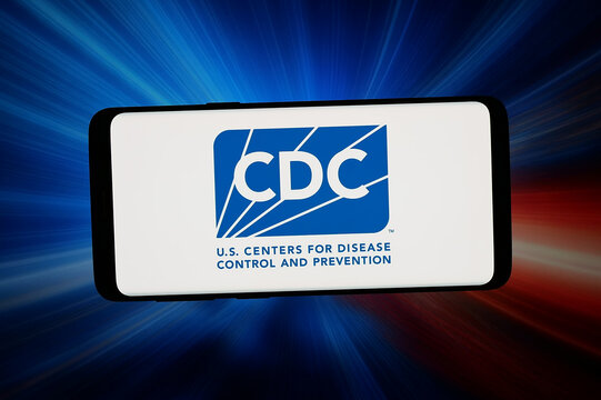 Stuttgart, Germany - 04-09-2026: In this photo illustration, the logo of US public health agency CDC is displayed on a smartphone in front of abstract background on computer screen.