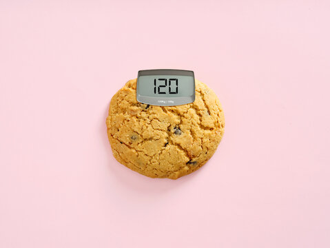 Cookie weighing calories for diet and healthy eating