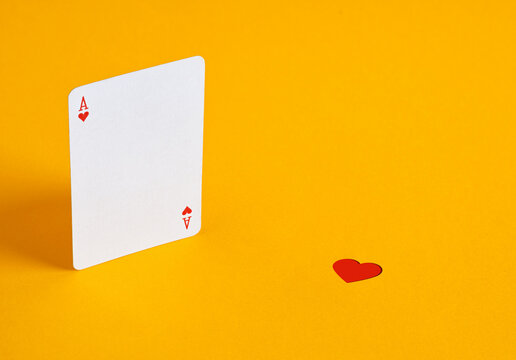 Ace of hearts playing card and heart symbol symbolizing lost love, a broken relationship, and missed opportunities