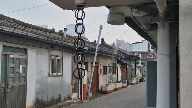 8K UHD Raindrops Falling from House Pillar in the Rain with Soft Focus