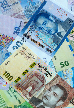 Moroccan dirham money banknotes pile on table. Morocco bills of MAD currency close up
