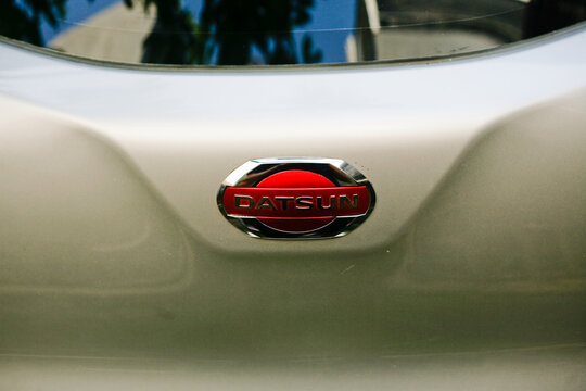 Close up of Datsun emblem logo on car