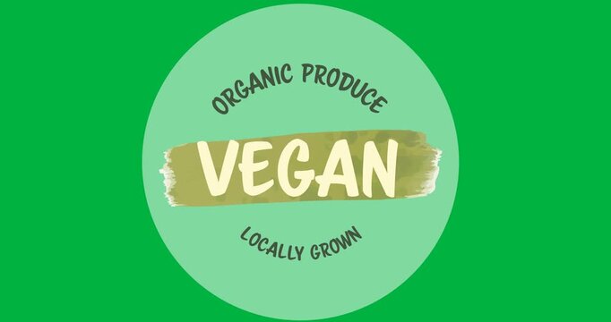 Organic produce vegan text with leaves icon over a grey round banner on black background