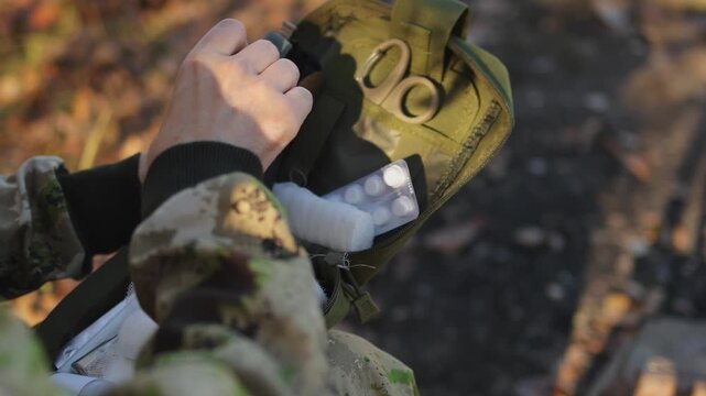 First aid kit. Green bag. War games. Slow motion video. High quality 4k footage