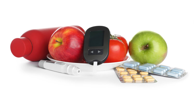 Diabetes. Composition with digital glucometer, bottle of water, pills and food isolated on white