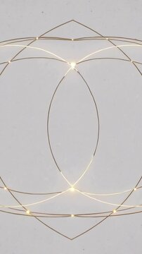 Vertical video: Starting symmetrical light ornament forming on gray canvas, glowing arcs and nodes