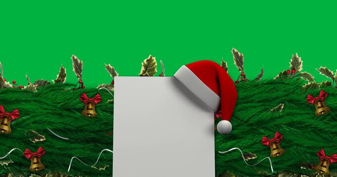 Santa hat over square banner with copy space over decorated green tree branch on black background