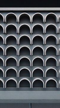 Vertical video: Actuators engaging left columns, panels flipping into arched niches at facade