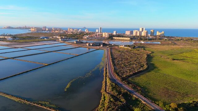 Aerial view of Salinas de Marchamalo and La Manga del Mar Menor at golden hour, Murcia, Spain
