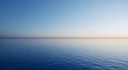Obraz premium Calm and serene ocean horizon at sunset with a clear blue sky and gentle ripples on the water surface, creating a peaceful and minimalist view