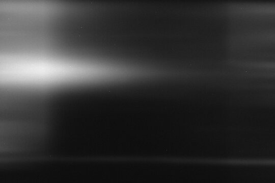 light leak overlay effect with scratch dust and light leaks,retro noisy film texture light leak flare on black background,abstract black and white background with motion blur lights,grunge film strip