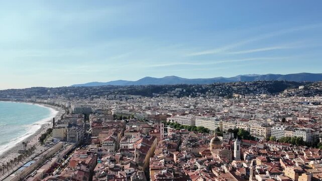 Nice city aerial view from hill overlooking mediterranean sea and promenade des anglais on sunny day.