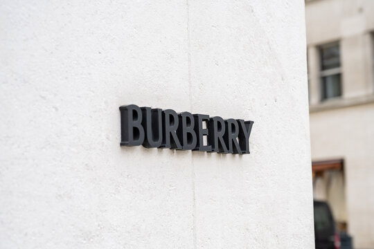 Burberry, luxury brand logo outside a flagship store in New Bond Street, a shopping street known for designer brands, London, England.