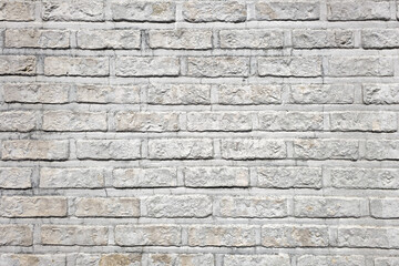 Obraz premium Light brick wall texture with uniform pattern and clean surface creating minimal architectural background.