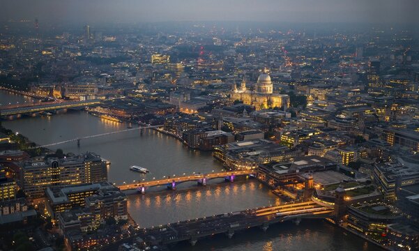 View of River Thames with London Bridge, Millenium Bridge and St. Paul's Cathedral, dusk, aerial view, London, England, United Kingdom