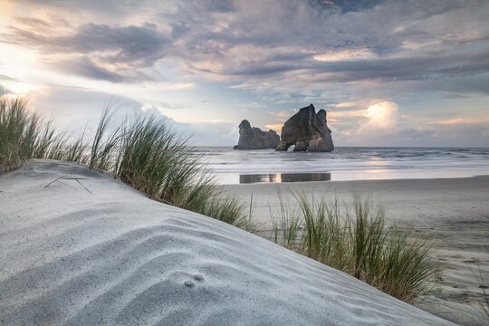 Rock island on Wharariki beach, Wharariki Beach, Golden Bay, Southland, New Zealand