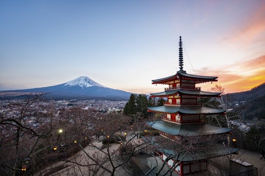 Five-story pagoda of a Shinto Shrine, Chureito Pagoda, with views of Fujiyoshida City and Mount Fuji volcano at sunset, Arakura Fuji Sengen Shrine, Arakurayama Sengen Park, Yamanashi Prefecture, Japan