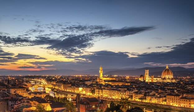 Illuminated city panorama at dusk with Florence Cathedral, Duomo Santa Maria del Fiore with the dome by Brunelleschi, Palazzo Vecchio, Ponte Vecchio, UNESCO World Heritage Site, Florence, Tuscany, Italy