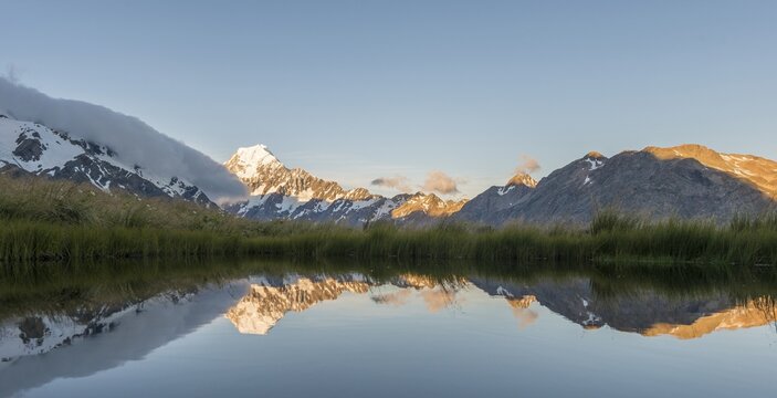 Reflection in mountain lake, sunset at Mount Cook, Sealy Tarns, Hooker Valley, Mount Cook National Park, Southern Alps, Canterbury, South Island, New Zealand