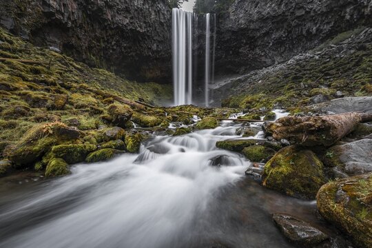 Waterfall plunges over rocky outcrop, Tamanawas Falls, time exposure, wild river Cold Spring Creek, Oregon, USA