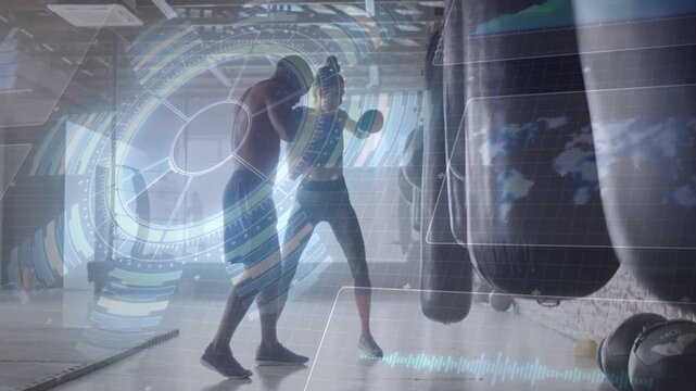 Boxing coach calling cues leaning, trainee throwing combos into mitts for skill AR HUD tracking