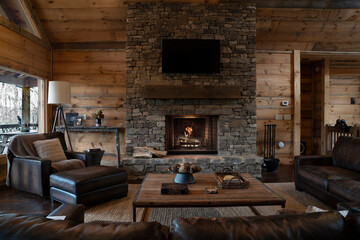 Obraz premium Main room of a rustic cabin with a fireplace in the Appalachian Mountains