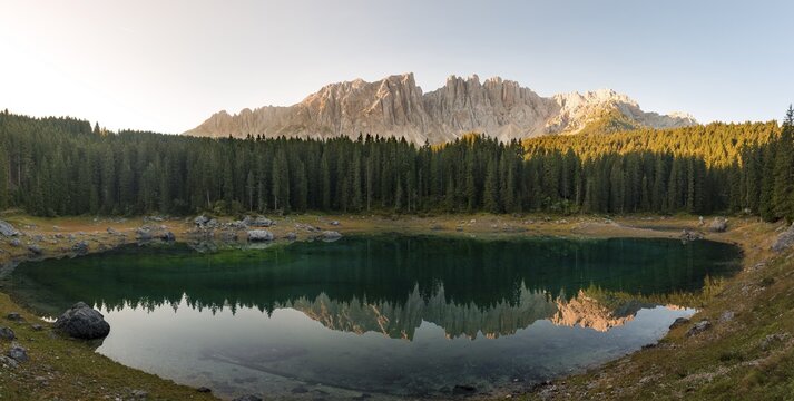 Morning atmosphere, Latemar group reflected in the Lake Carezza, Lago di Carezza, mountaintop of the Torre Diamantidi, eastern Latemarspitze, Col Coron, Welschnofen, Bozen, South Tyrol, Italy