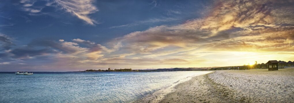 Sandy beach beach and coral reef Abu-Dabbab at sunset, Hilton Nubian Resort, Al Qusair, Marsa Alam, Egypt