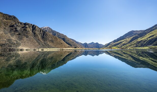 Panorama, mountains reflecting in lake, Moke Lake near Queenstown, Otago Region, Southland, New Zealand