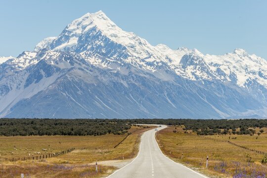 Road with view to Mount Cook, snowy mountains, Mount Cook National Park Southern Alps, Canterbury, South Island, New Zealand