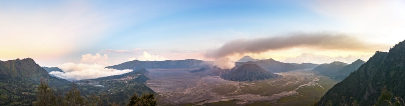 Caldera Tengger, view of Cermo Lawang village and volcanoes at sunset, smoking volcano Gunung Bromo, with Mt. Batok, Mt. Kursi, Mt. Gunung Semeru, National Park Bromo-Tengger-Semeru, Java, Indonesia