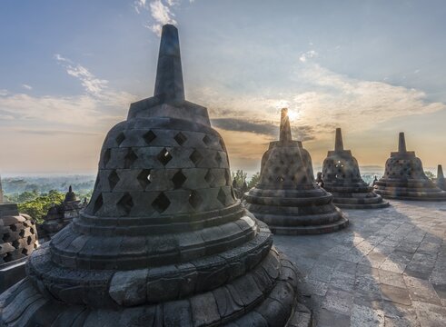 Borobudur temple at sunrise, stupas, cloudy sky, Borobudur, Yogyakarta, Java, Indonesia