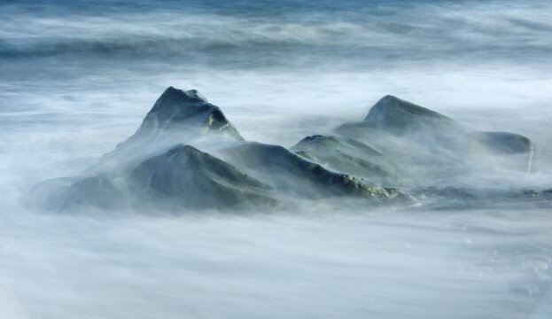 Waves breaking against rocks, Iceland