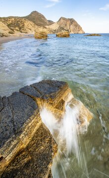 Waves crashing against rocks, sandy beach with rocky cliffs, Paralia Paradisos, Kos, Dodecanese, Greece