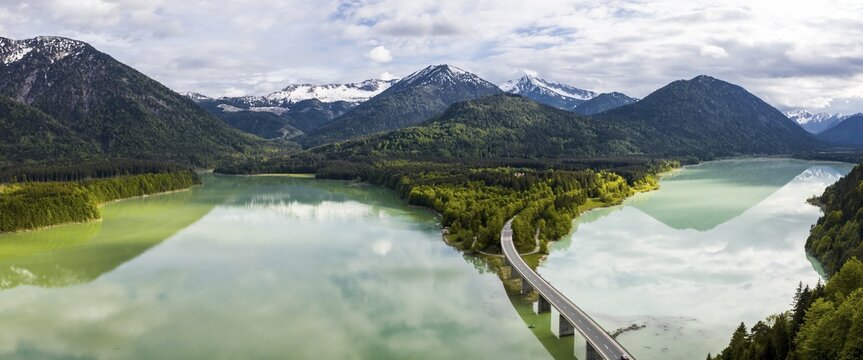 Sylvenstein lake and Faller-Klamm bridge, Sylvenstein reservoir, cloudy sky, near Lenggries, Isarwinkel, aerial view, Upper Bavaria, Bavaria, Germany