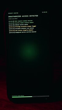 Vertical video. Close Up Of Smartphone Screen With Phone Hacked Warning And Critical Breach Message While Hand Holds Device In Dark Red Lighting Showing Immediate Cyber Security Threat Scenario