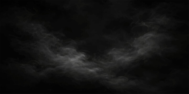 Dark smoke drifting over a black background creating a mysterious abstract atmosphere